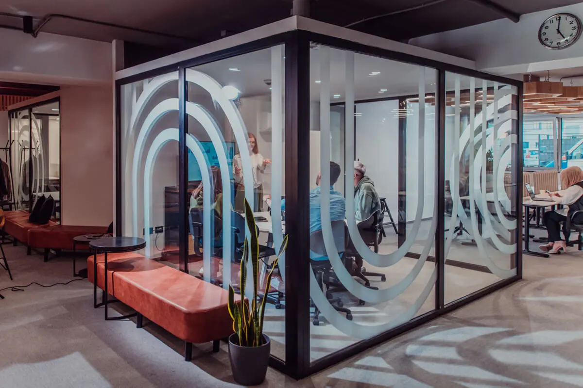 Modern office meeting room with glass walls.